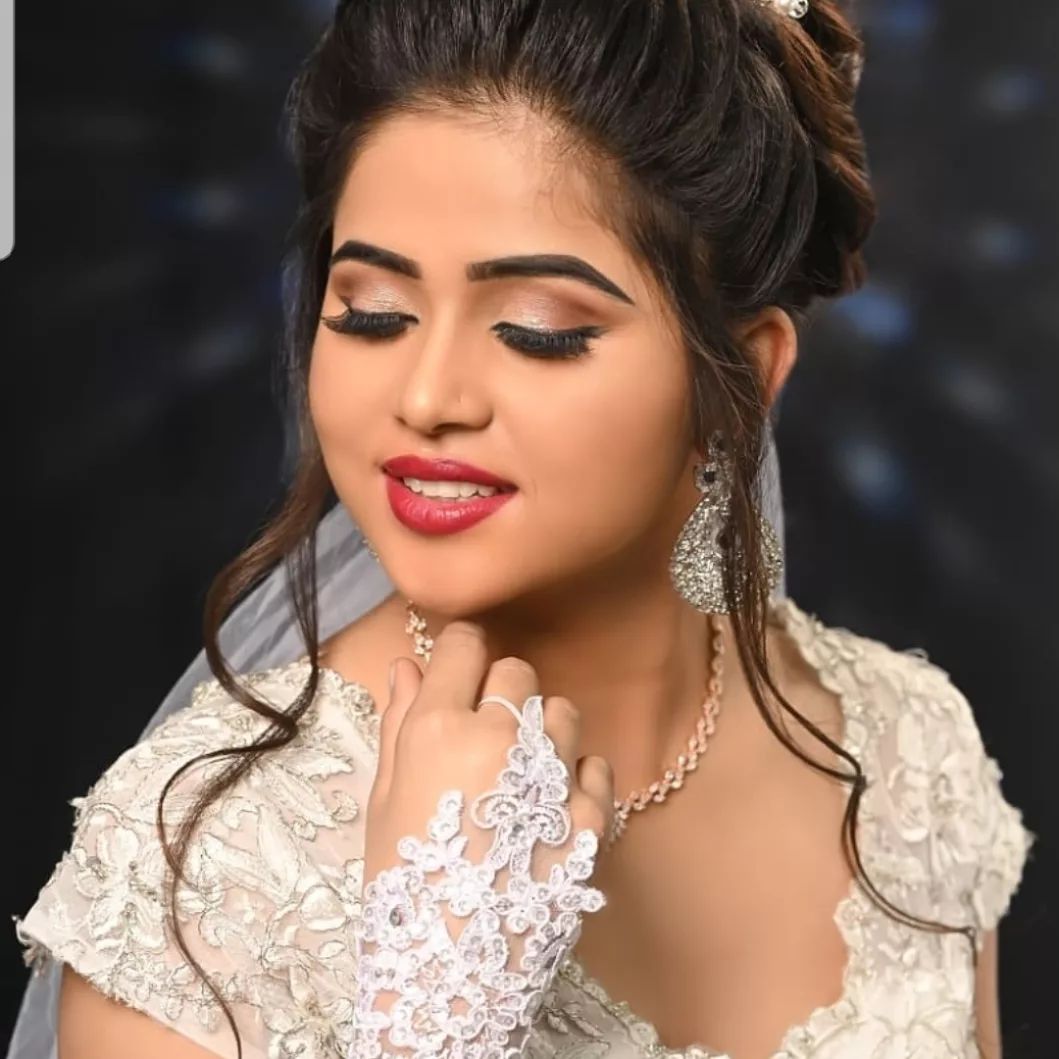 Mom painting daughter face for Halloween party.