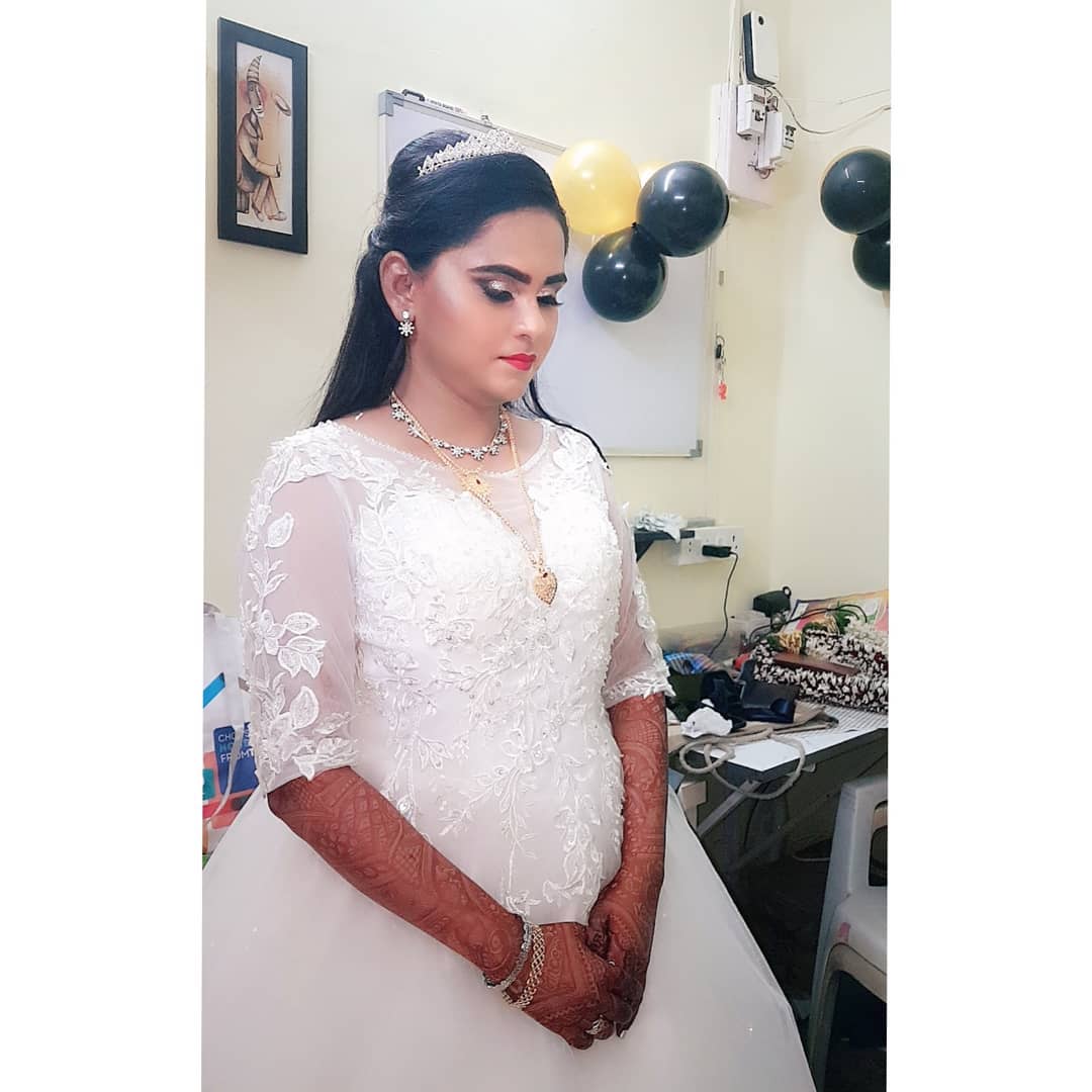 Visagiste and lady chooses cosmetic in makeup shop